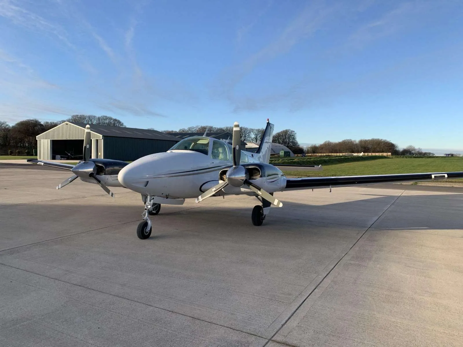 Exterior view of a 1976 Beechcraft Baron B55, G-DGST.