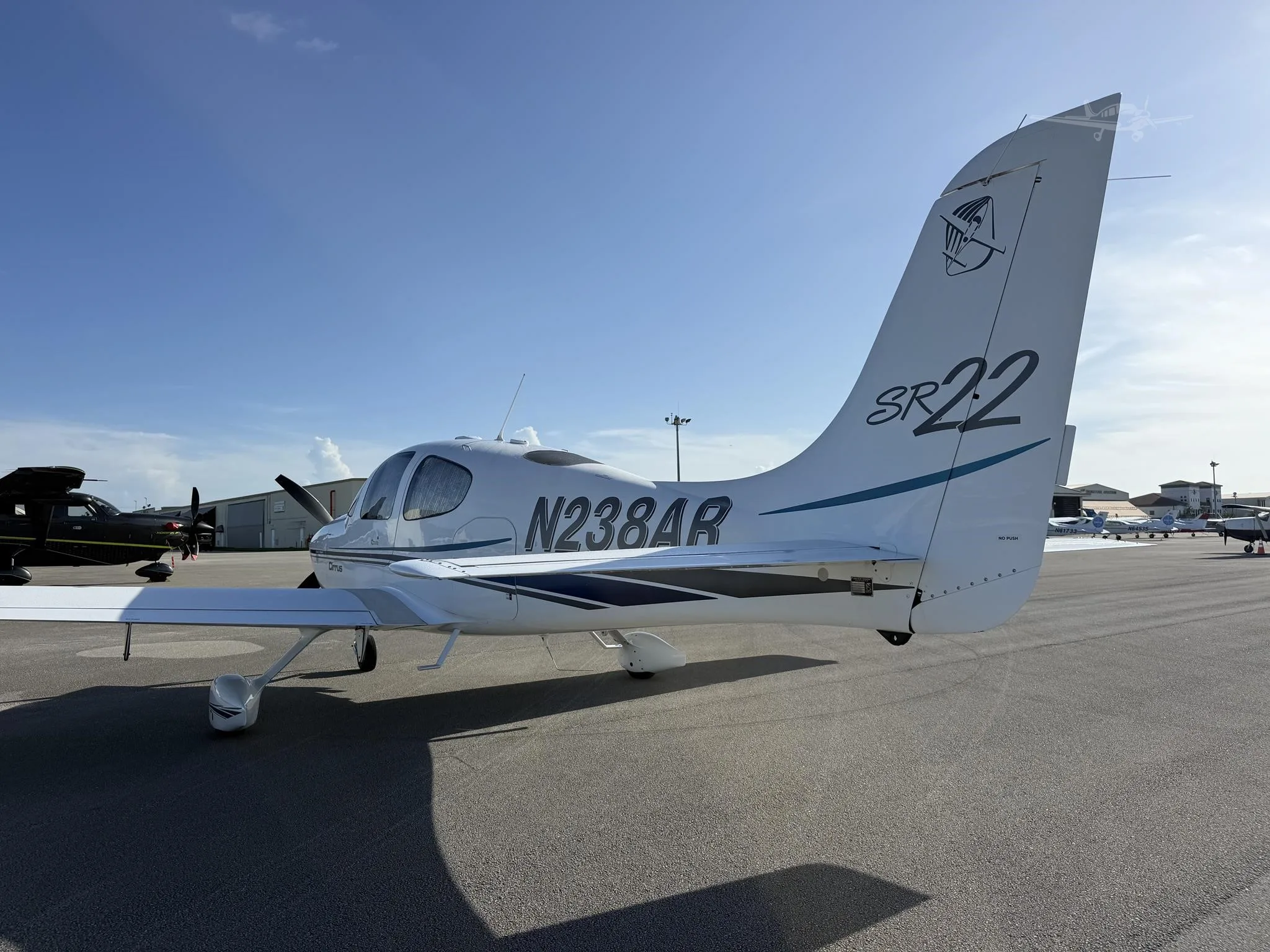 Exterior view of a 2002 CIRRUS SR22, N238AR.