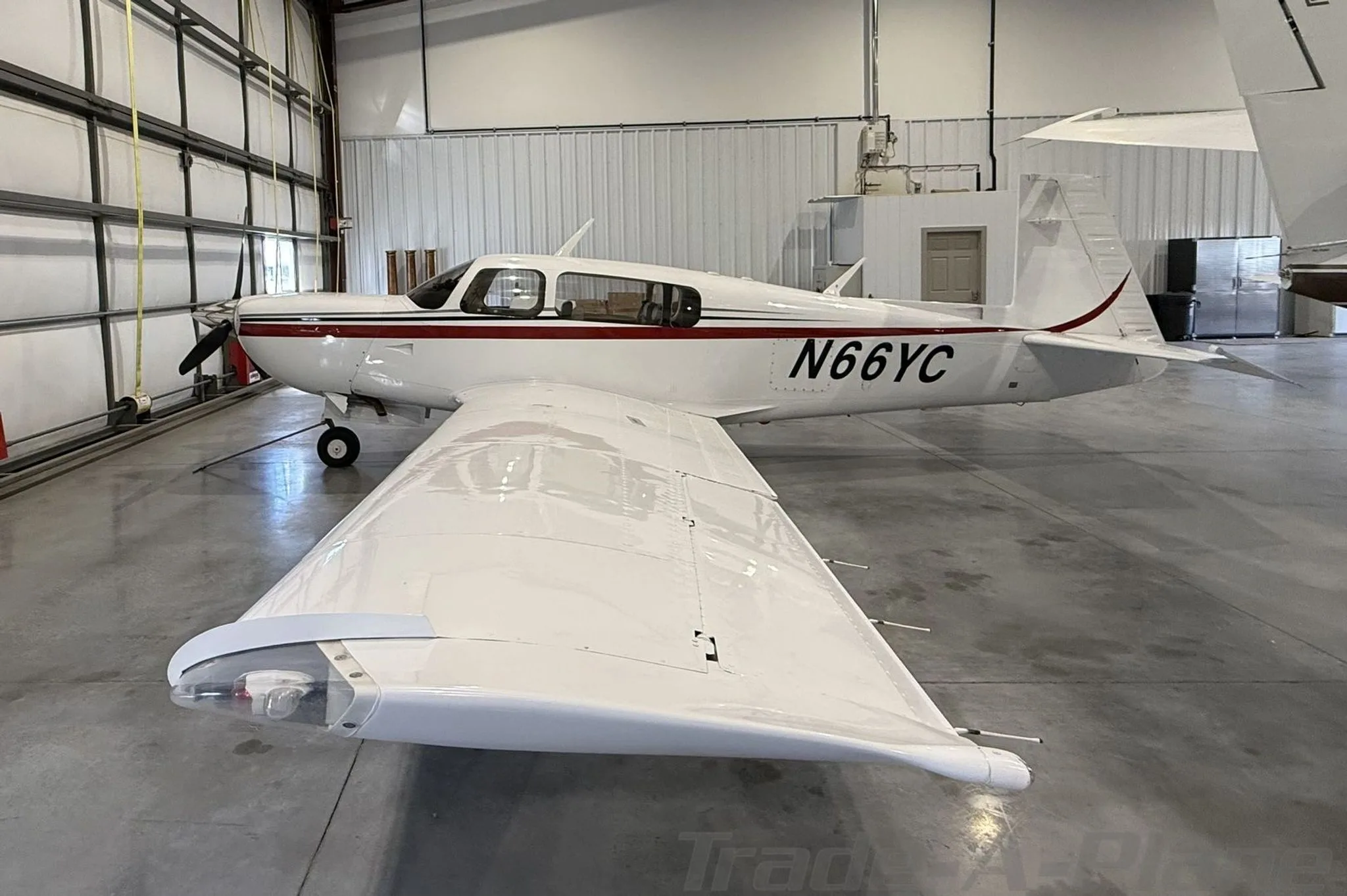 Exterior view of a 2005 MOONEY M20M GX BRAVO, N66YC.