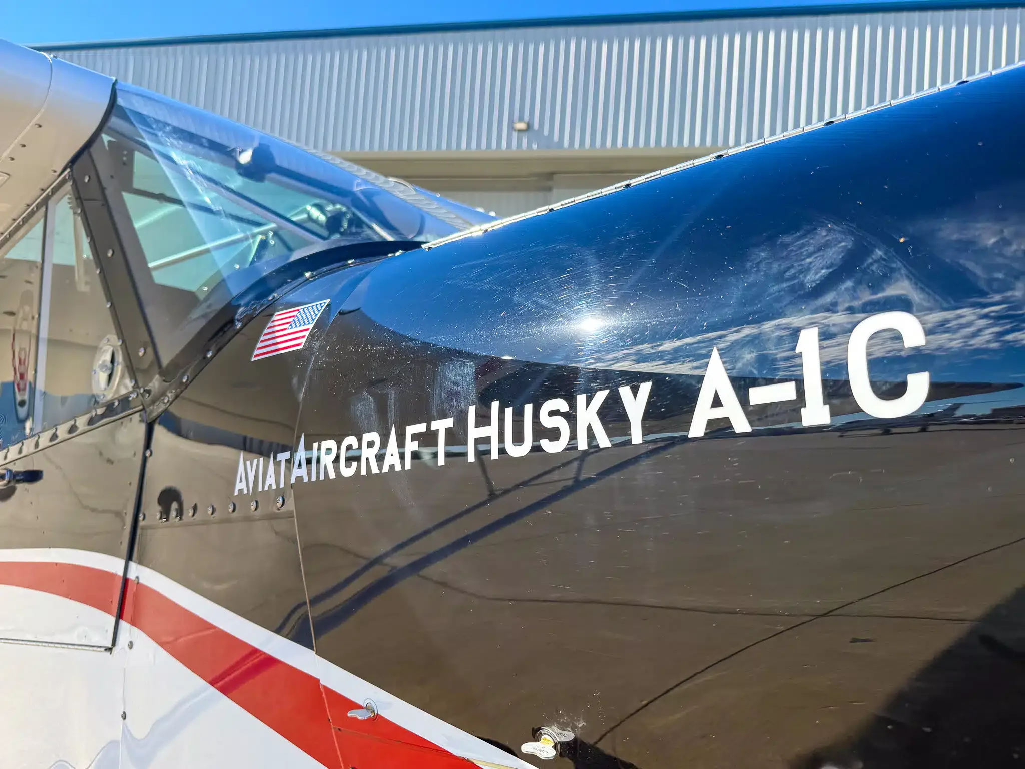 Exterior view of a 2010 Aviat A-1C Husky, N409BW.