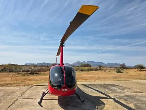 Exterior view of a 2013 ROBINSON R66.