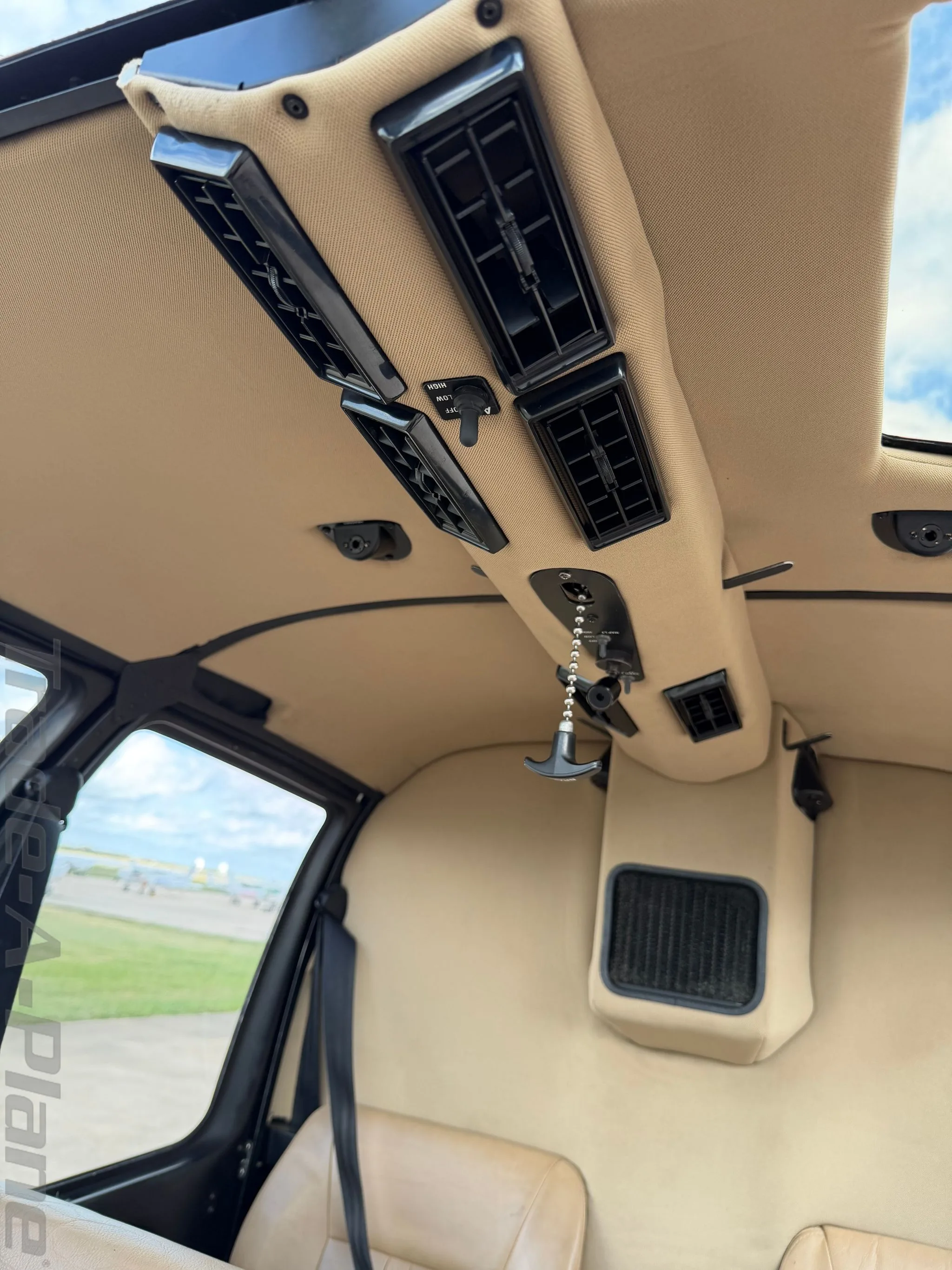 Cockpit and instrument panel of a 2015 ROBINSON R44 RAVEN II.