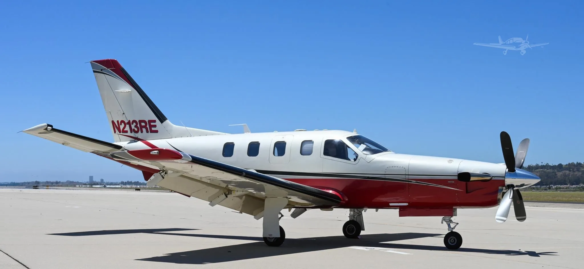 Exterior view of a 2002 DAHER TBM 700B, N213RE.