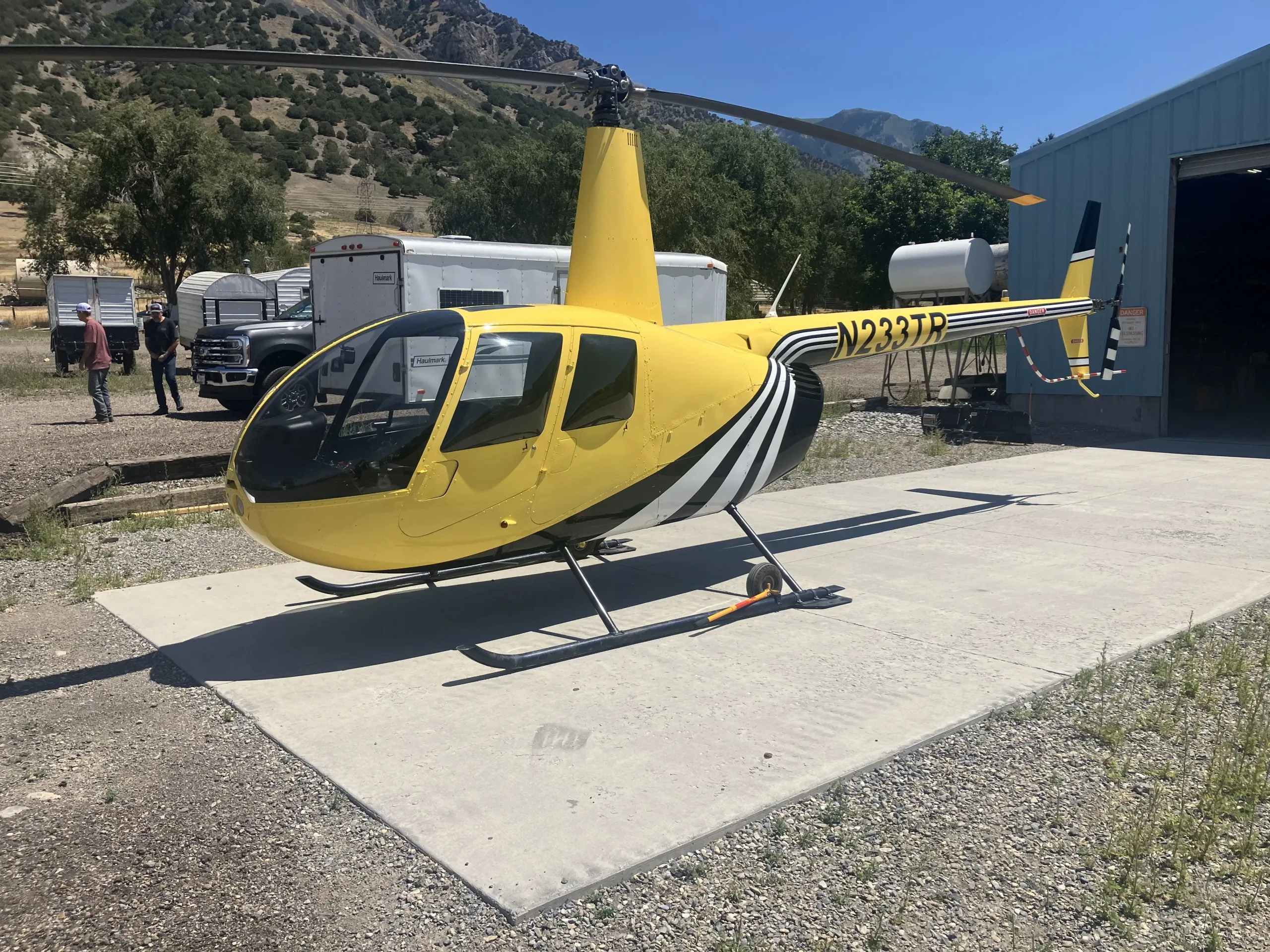 Exterior view of a 2003 Robinson R44 II, N233TR.