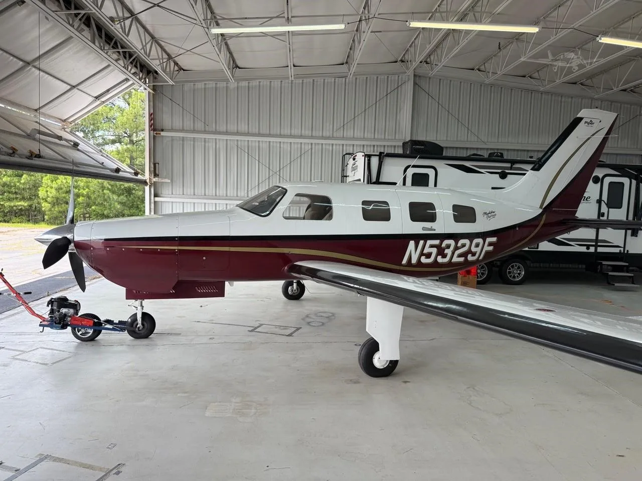 Exterior view of a 2002 PIPER MALIBU MIRAGE, N5329F.