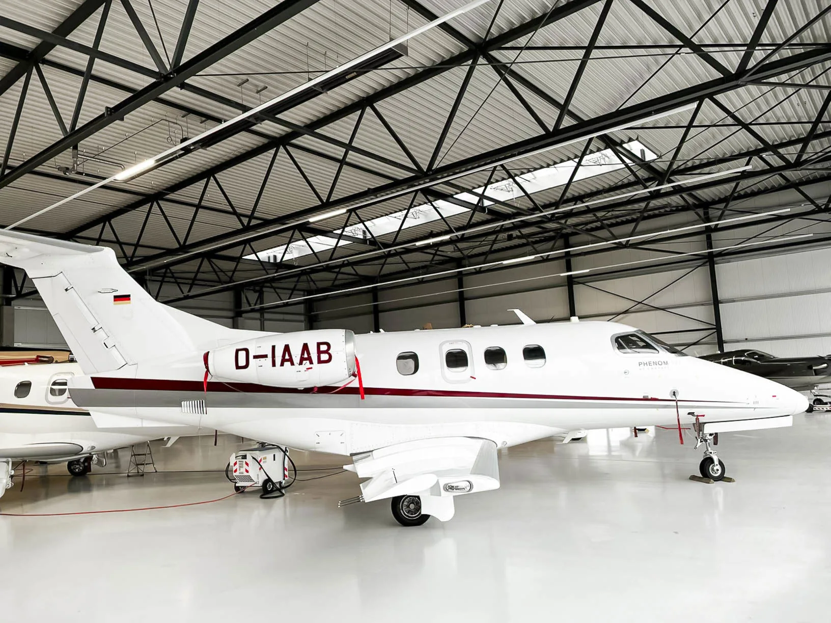 Exterior view of a 2010 Embraer Phenom 100, D-IAAB.