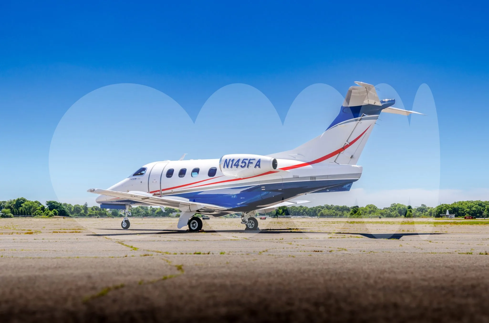 Exterior view of a 2009 Embraer Phenom 100.
