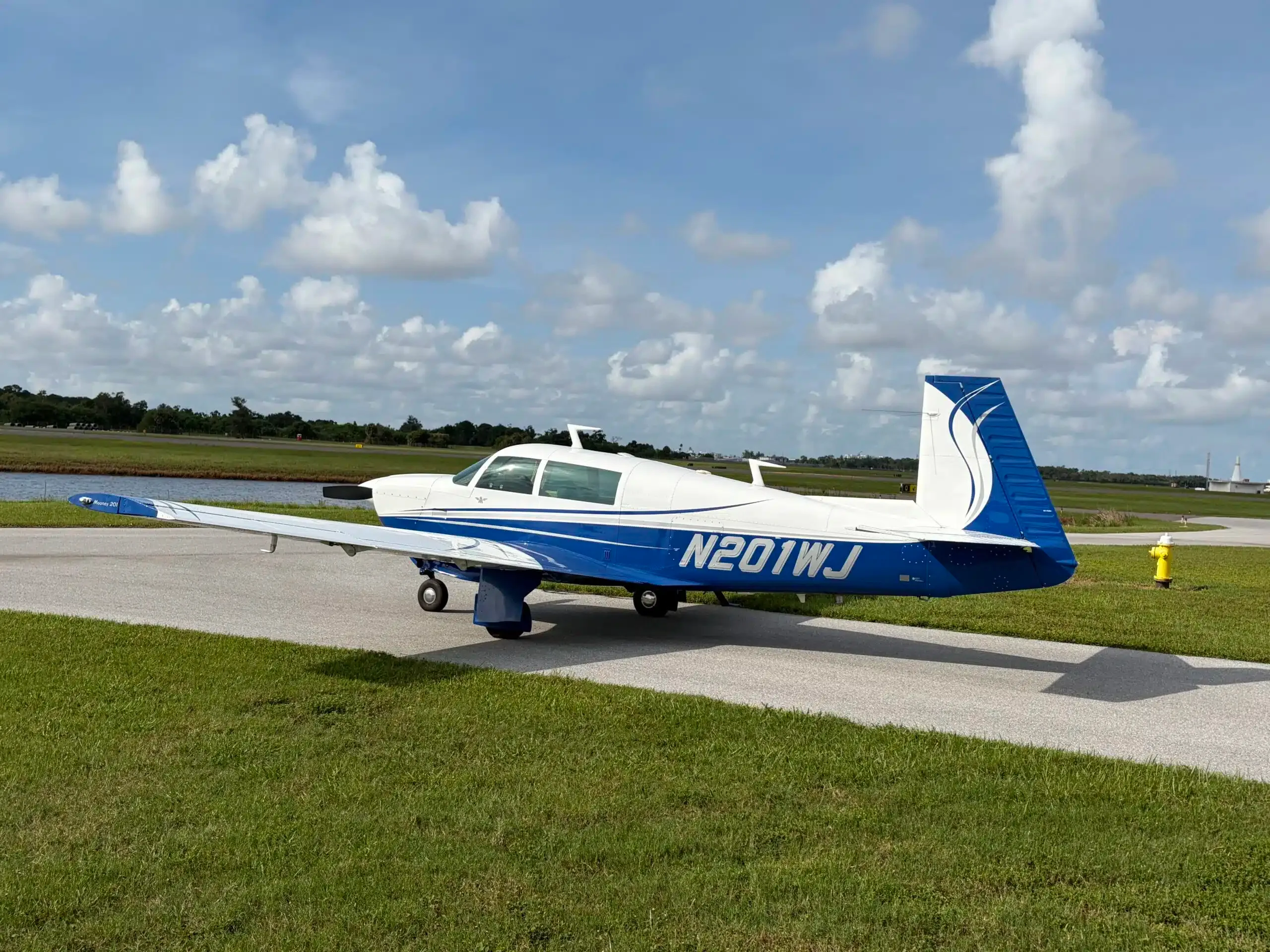 Exterior view of a 1977 Mooney M20J, N201WJ.