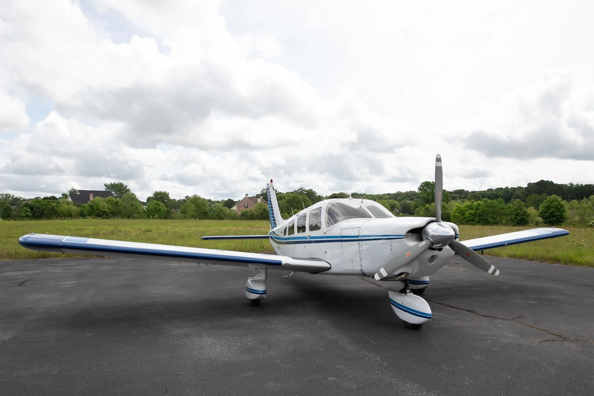 Exterior view of a 1977 PIPER CHEROKEE 6/300, N2617M.