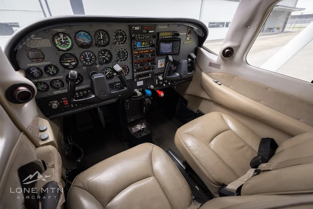 Cockpit and instrument panel of a 1999 Cessna 206H Stationair.