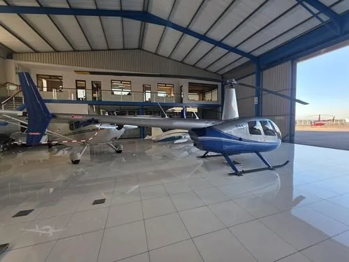 Exterior view of a 2007 ROBINSON R44 RAVEN II, N611TH.
