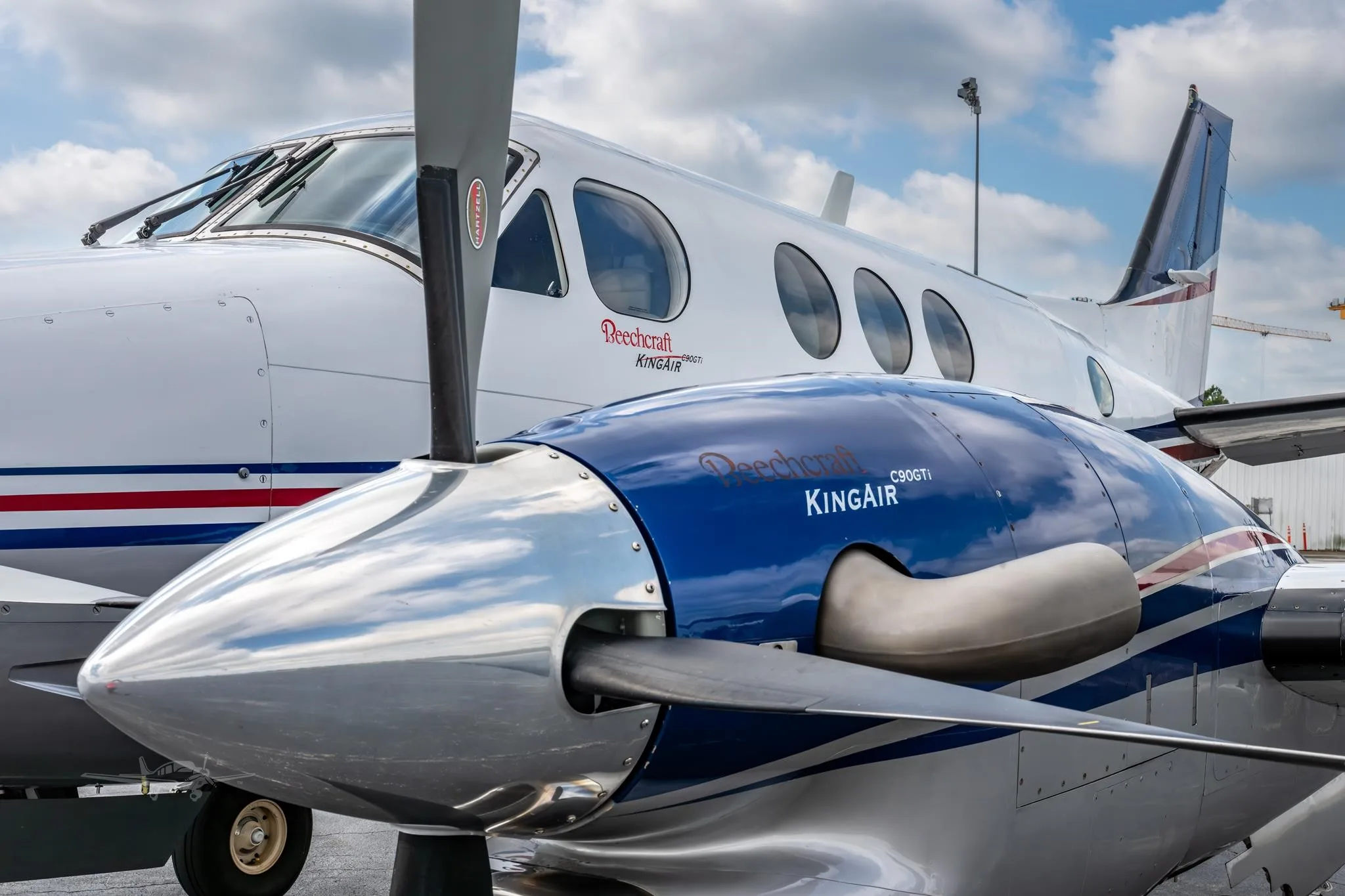 Exterior view of a 2009 BEECHCRAFT KING AIR C90GTI, N6211J.