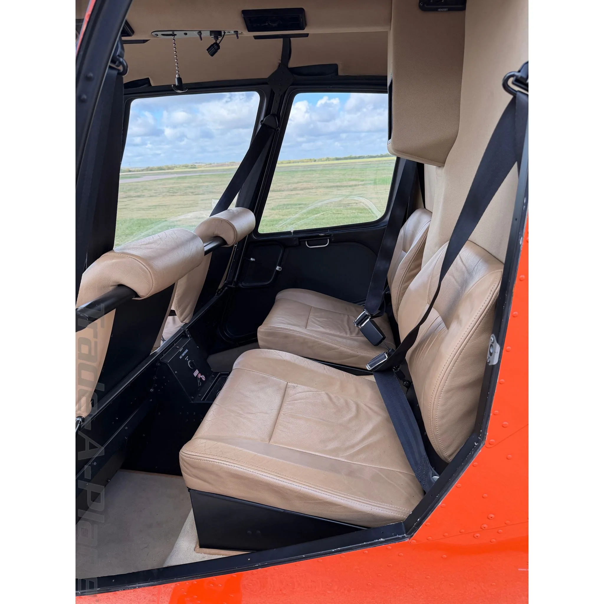 Exterior view of a 2015 ROBINSON R44 RAVEN II, N918BS.