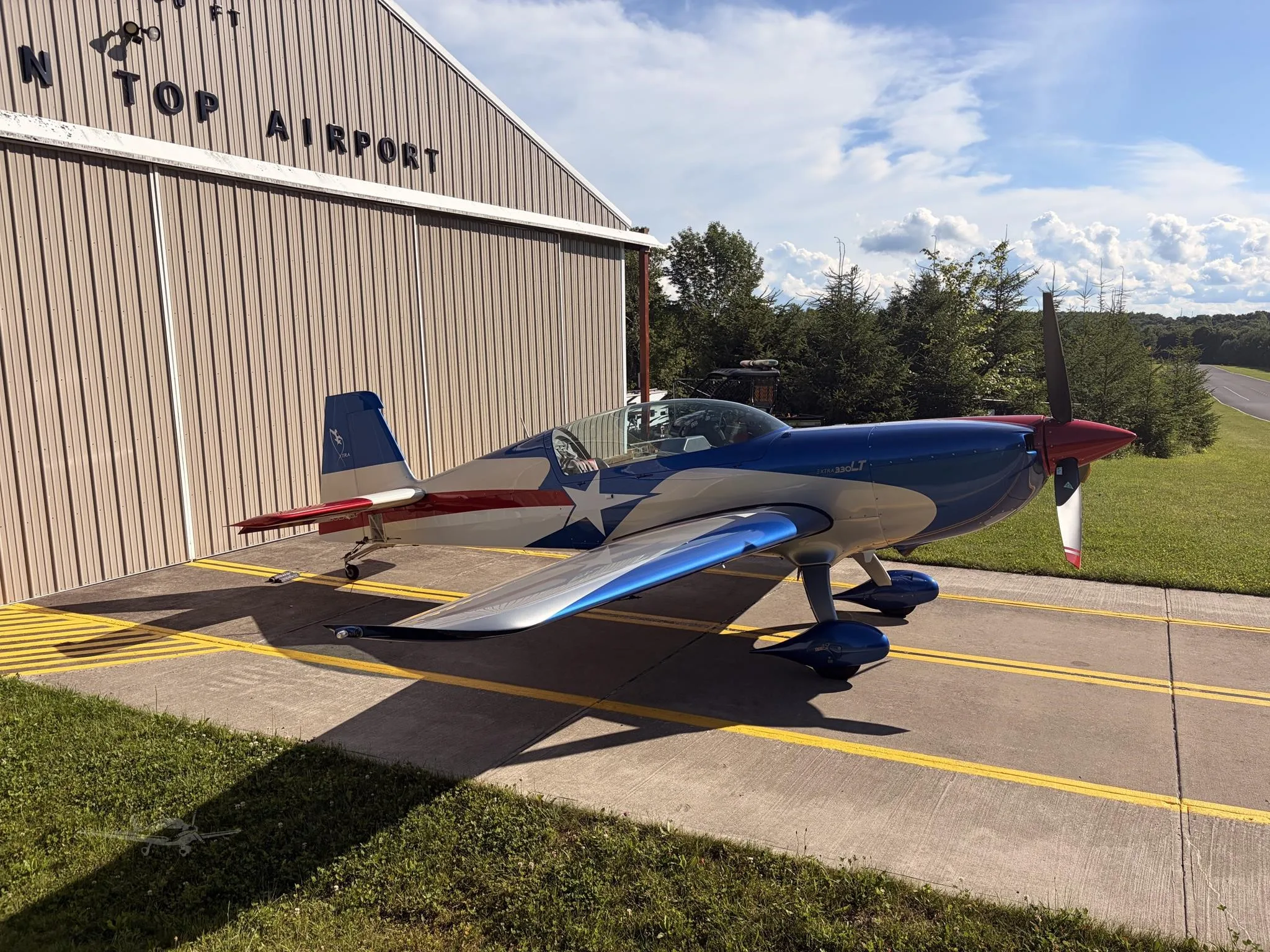Exterior view of a 2014 EXTRA AIRCRAFT EA 330LT, N328LT.
