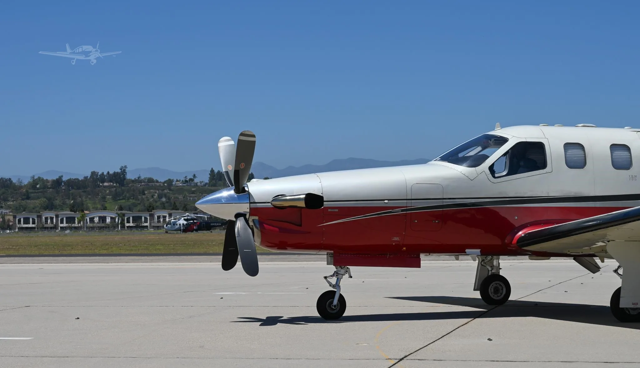 Exterior view of a 2002 DAHER TBM 700B, N213RE.