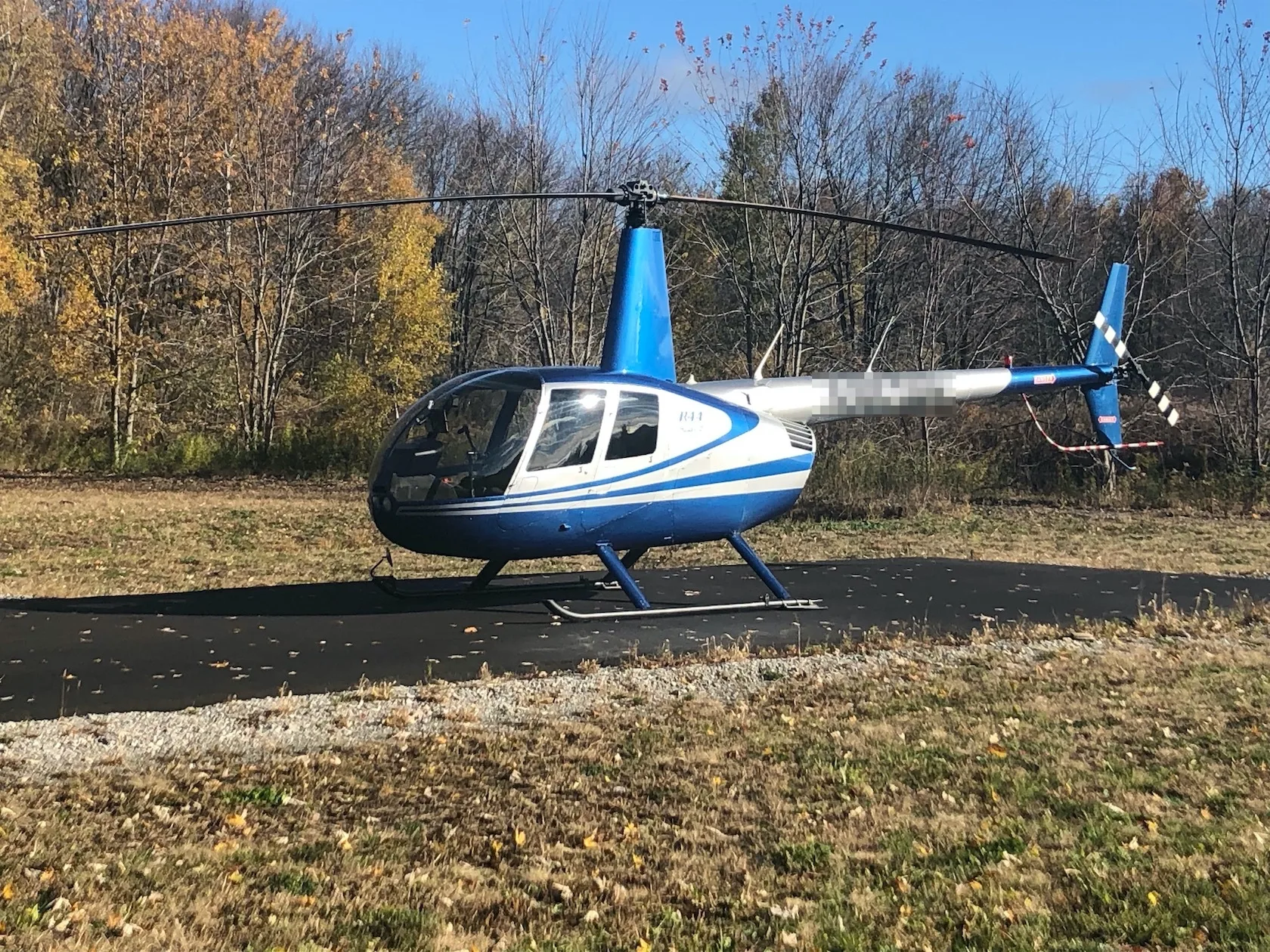 Exterior view of a 2004 Robinson R44 Raven II, N987WH.