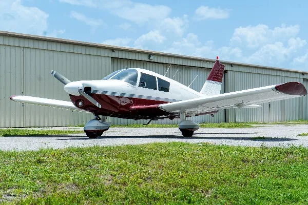 Exterior view of a 1968 Piper Cherokee 140, N8013N.
