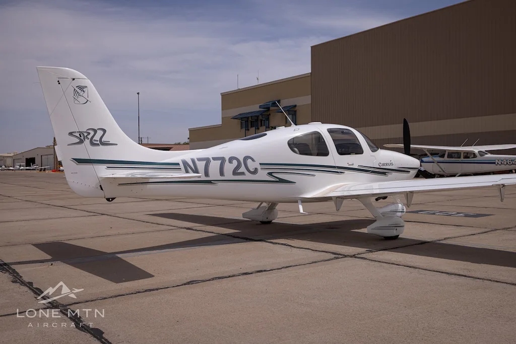 Exterior view of a 2002 Cirrus SR22, N772C.