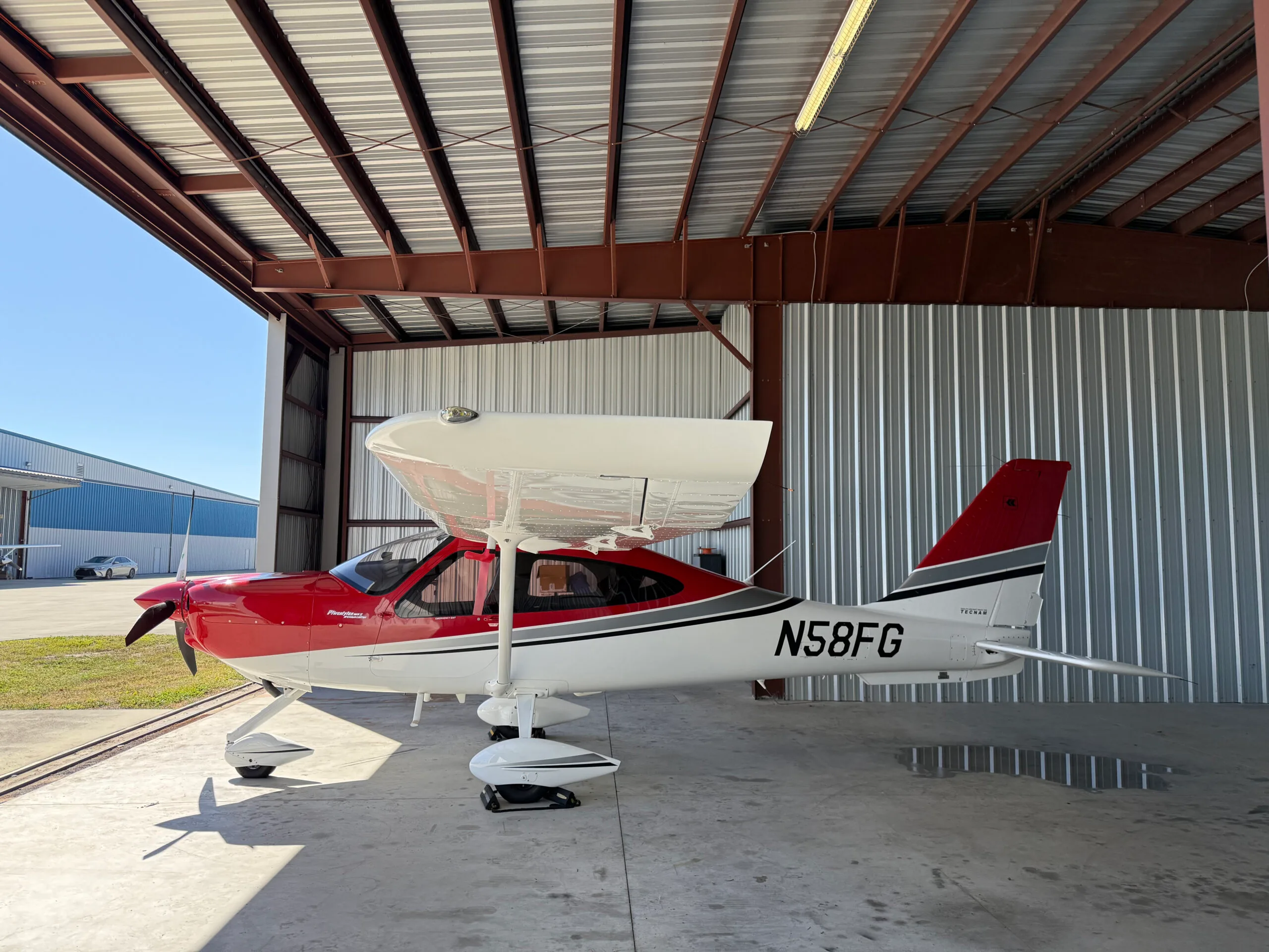Exterior view of a 2022 Tecnam P2010 MkII, N58FG.