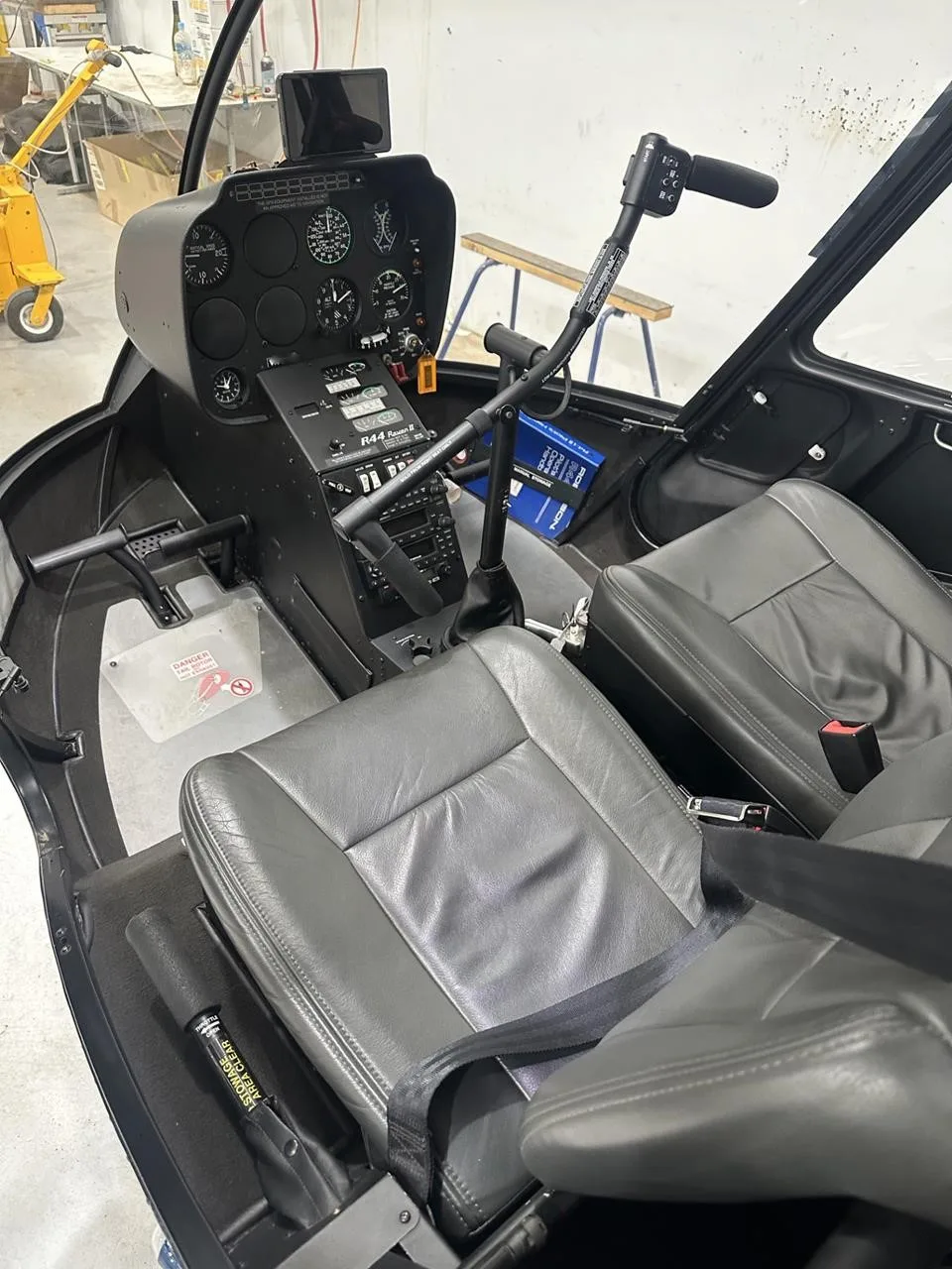 Cockpit and instrument panel of a 2021 ROBINSON R44 RAVEN II.