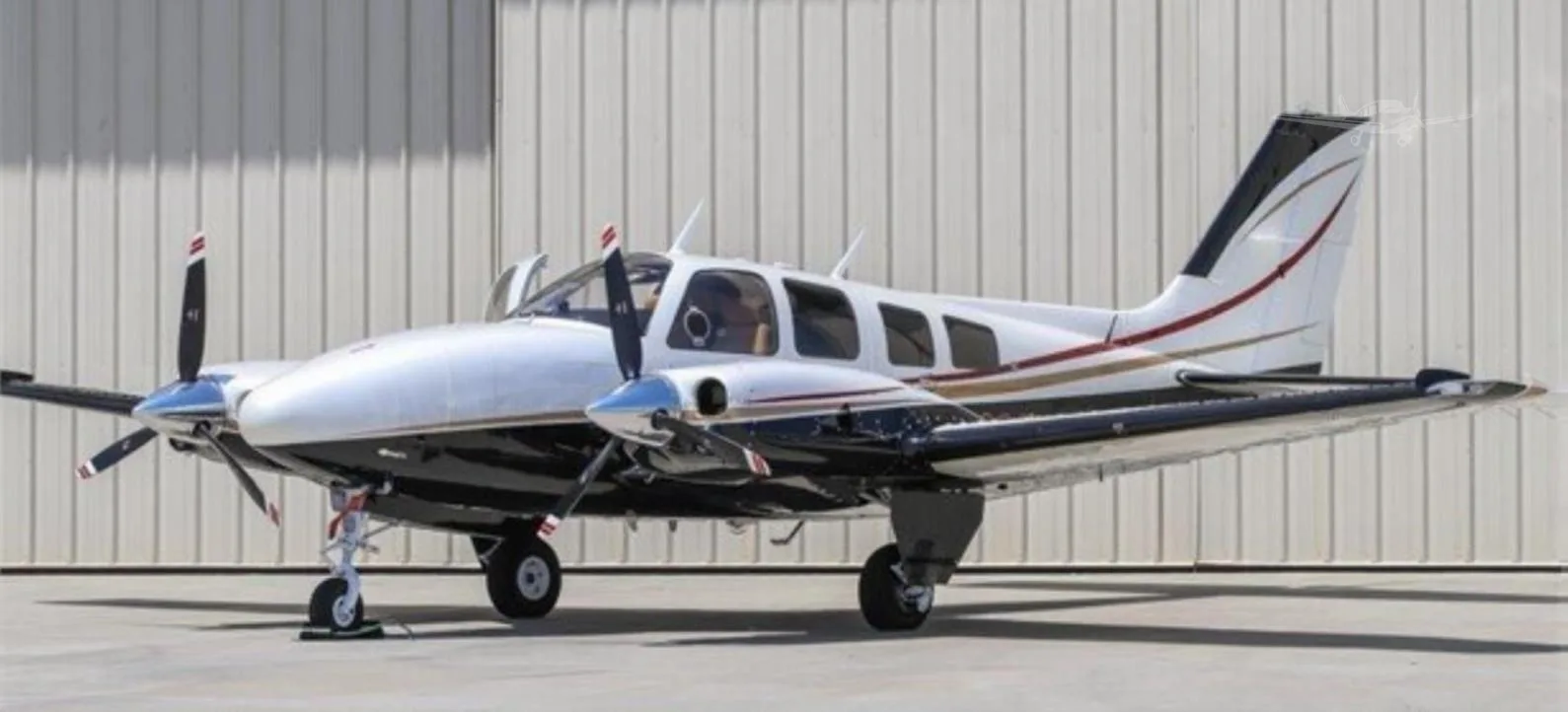 Exterior view of a 1977 BEECHCRAFT 58P BARON, N966UB.