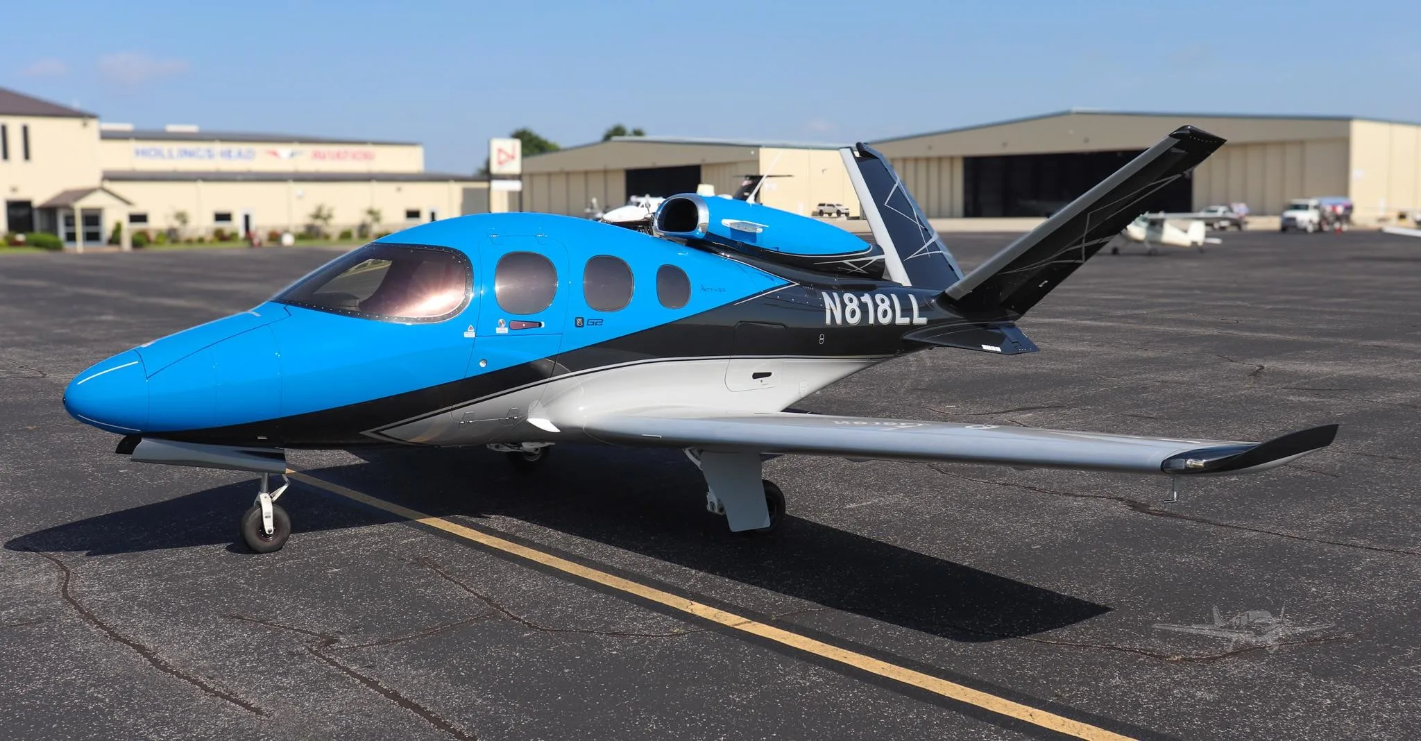 Exterior view of a 2021 CIRRUS VISION SF50-G2+, N818LL.