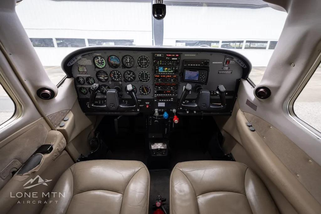 Cockpit and instrument panel of a 1999 Cessna 206H Stationair.