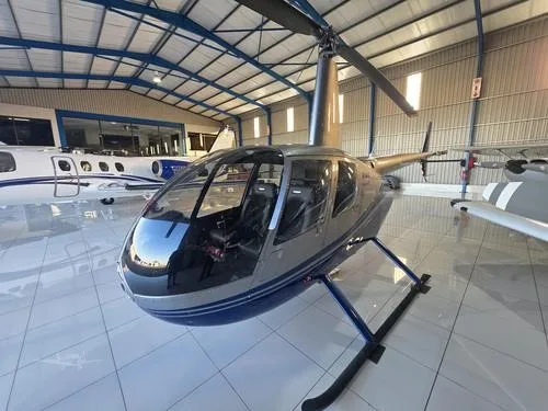 Exterior view of a 2007 ROBINSON R44 RAVEN II, N611TH.