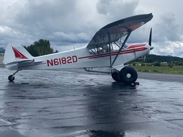 Exterior view of a 1957 Piper PA-18-150, N6182D.