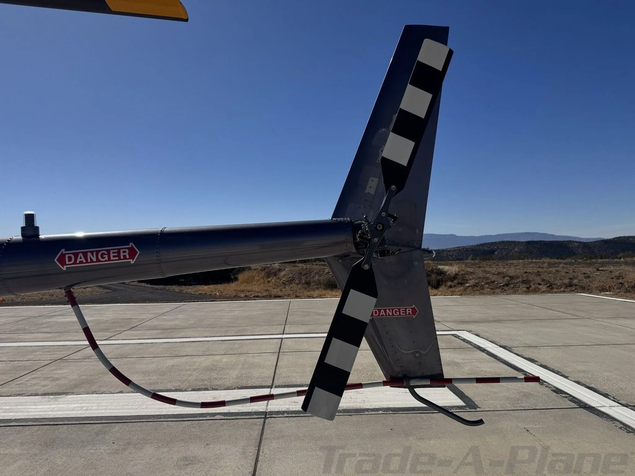 Exterior view of a 2002 ROBINSON R44 RAVEN II, N622.
