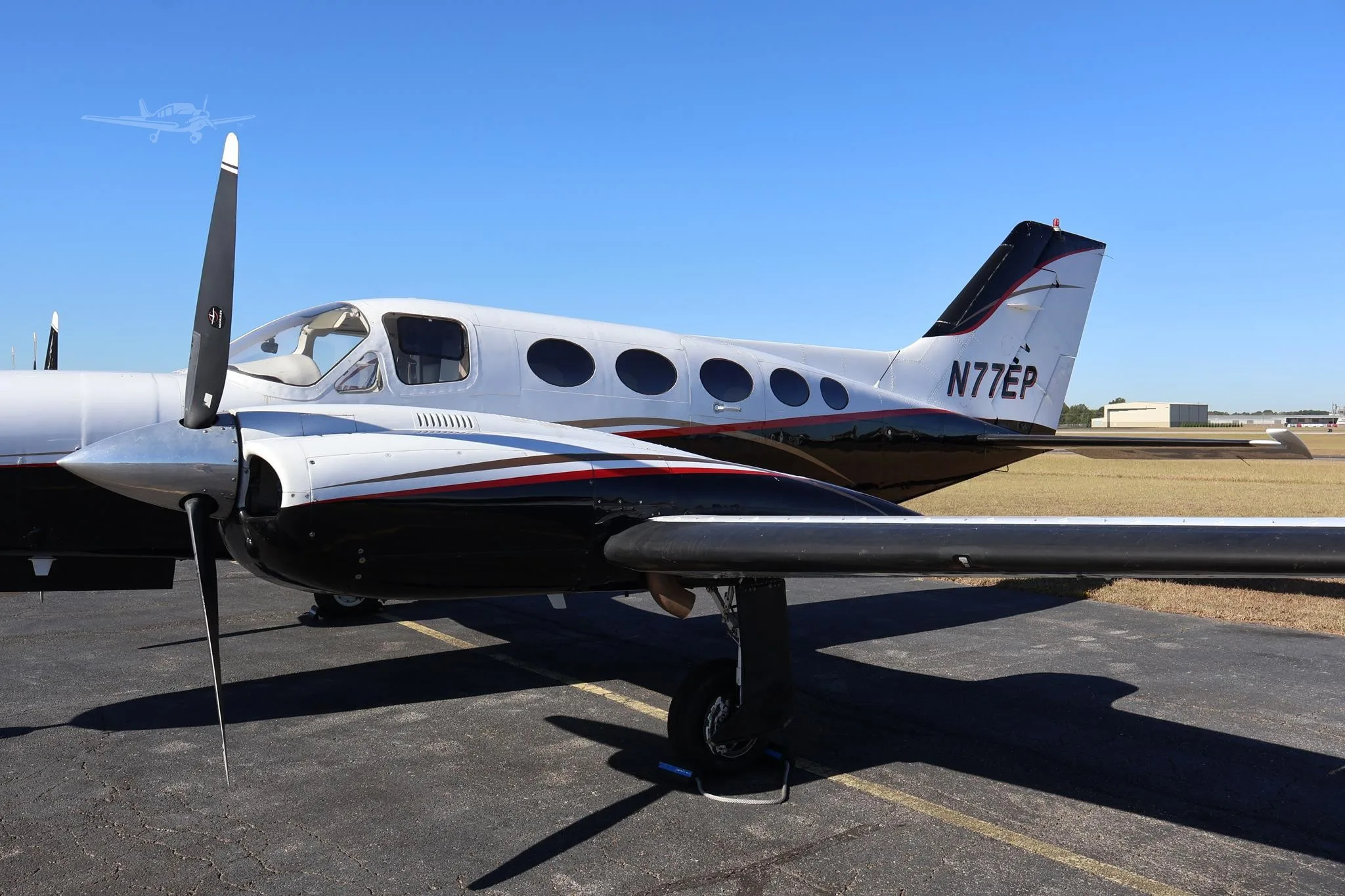 Exterior view of a 1973 CESSNA 421B, N77EP.