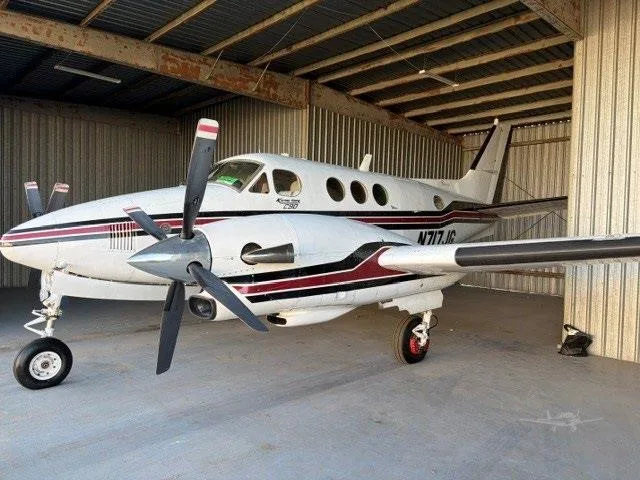 Exterior view of a 1975 BEECHCRAFT KING AIR C90, N717JG.