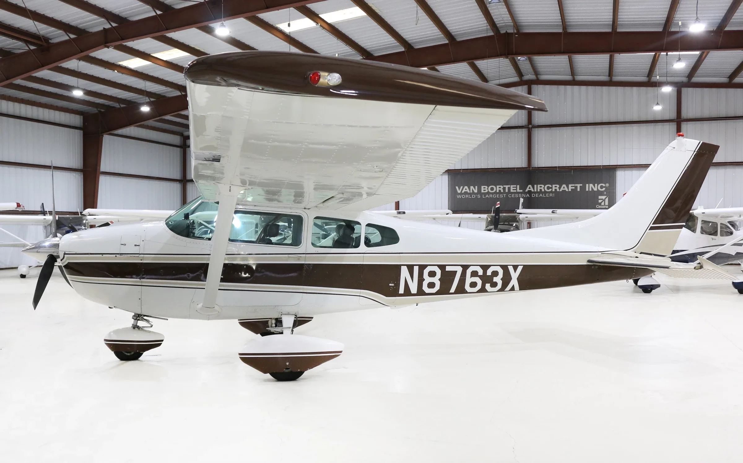 Exterior view of a 1961 Cessna 182D, N8763X.