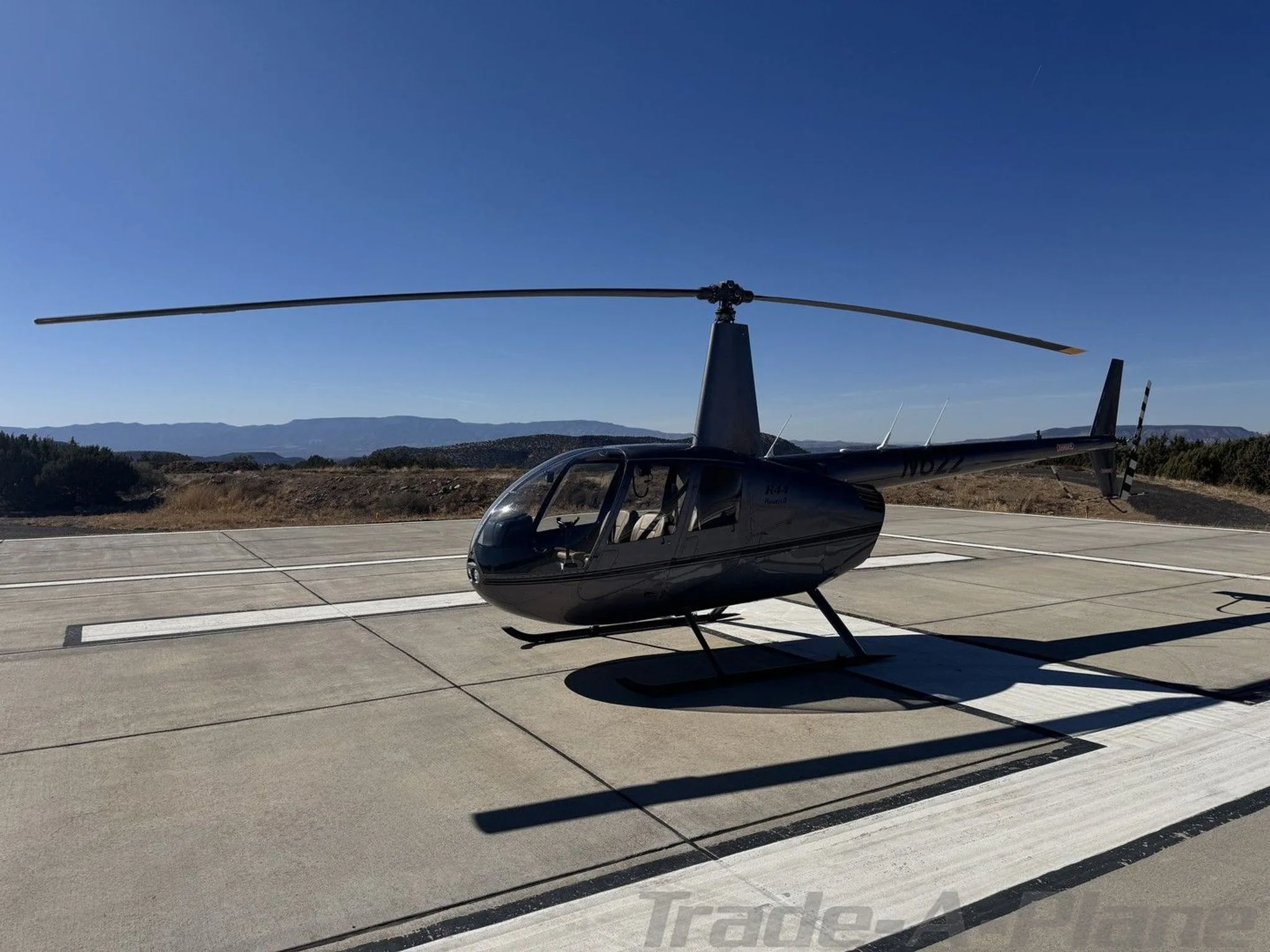 Exterior view of a 2002 ROBINSON R44 RAVEN II, N622.