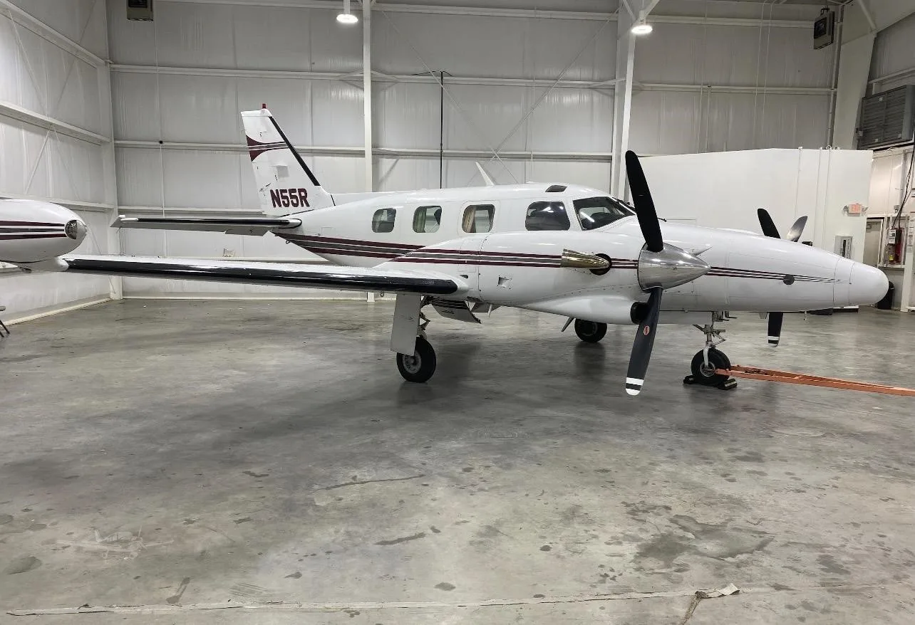 Exterior view of a 1976 PIPER CHEYENNE II, N55R.
