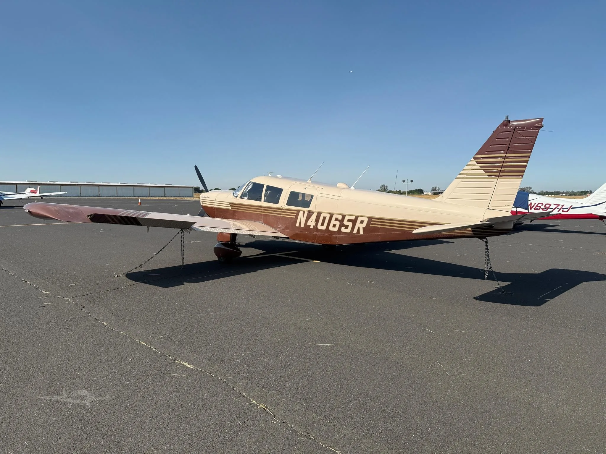Exterior view of a 1967 PIPER CHEROKEE 6/300, N4065R.