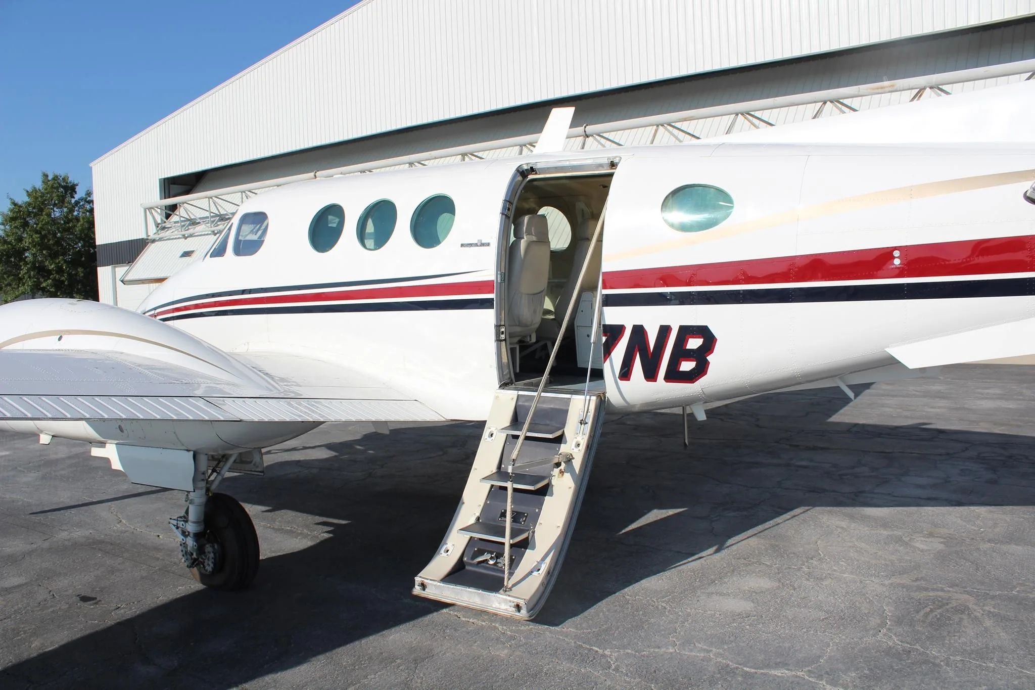 Exterior view of a 1979 BEECHCRAFT KING AIR C90, N77NB.