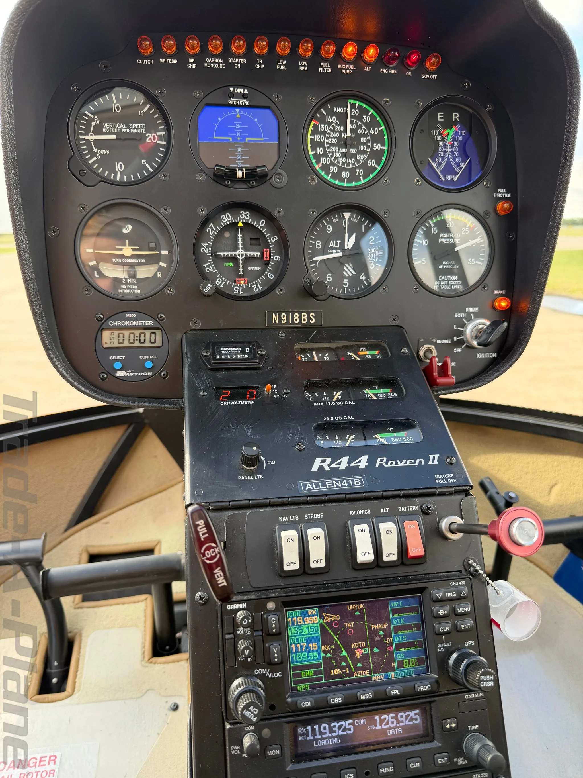 Cockpit and instrument panel of a 2015 ROBINSON R44 RAVEN II.