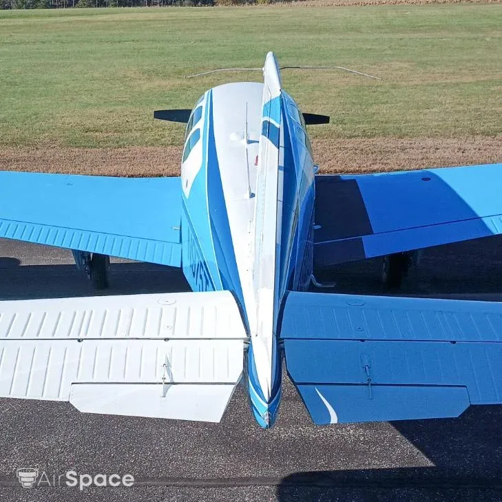 Exterior view of a 1960 Beechcraft, N975T.