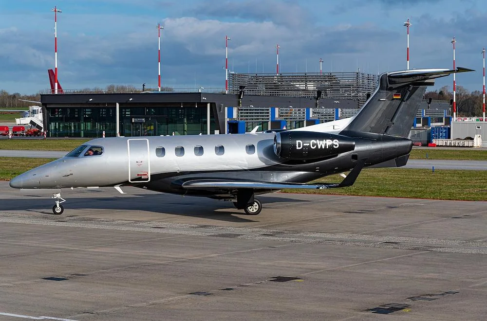 Exterior view of a 2016 Embraer Phenom 300, D-CWPS.