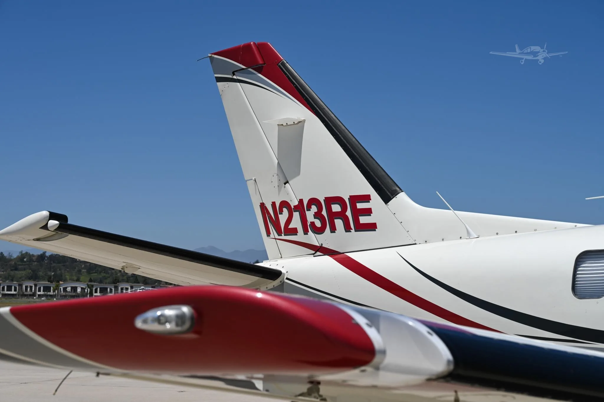 Exterior view of a 2002 DAHER TBM 700B, N213RE.