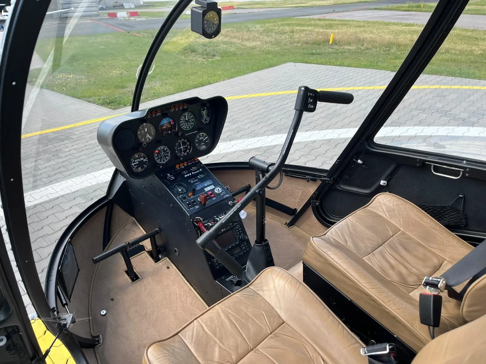 Cockpit and instrument panel of a 2009 ROBINSON R44 RAVEN II.