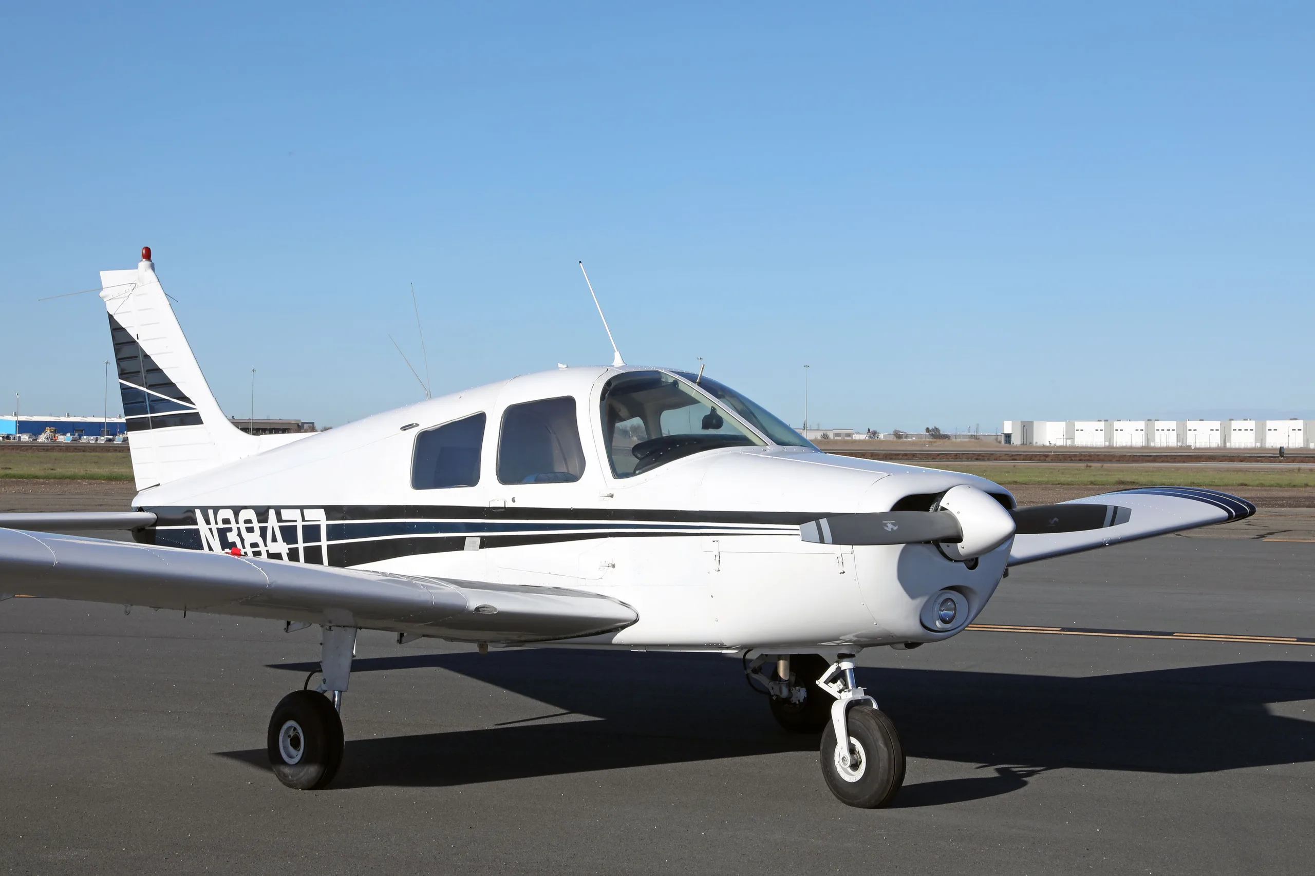 Exterior view of a 1977 Piper Cherokee 140, N38477.