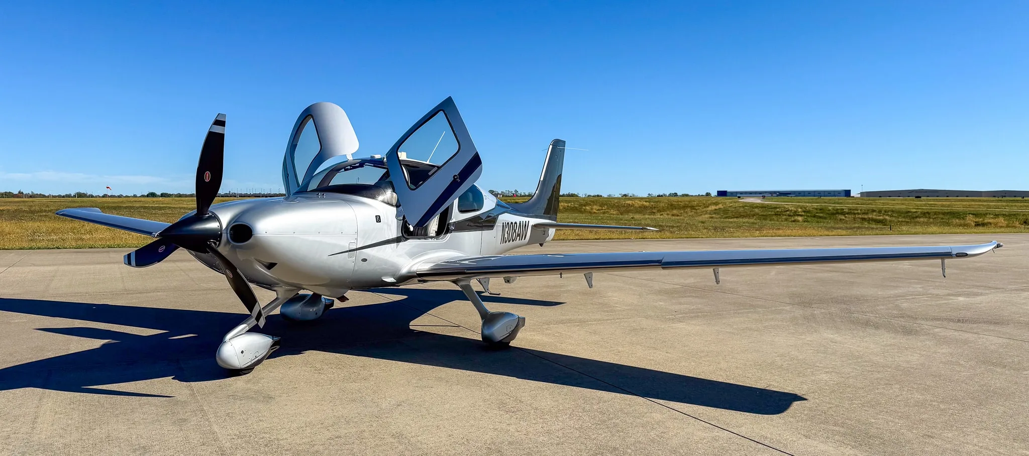 Exterior view of a 2014 Cirrus SR22T G5 GTS, N308AW.