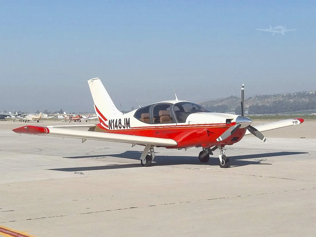 Exterior view of a 2000 SOCATA TB-21 GT TRINIDAD, N148JM.