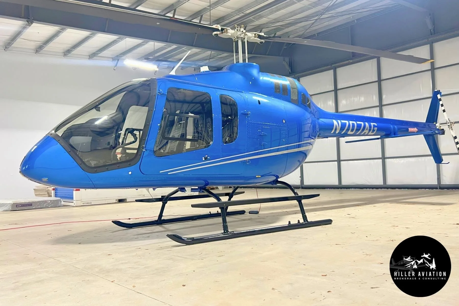 Exterior view of a 2025 BELL 505 JET RANGER X, N707AG.