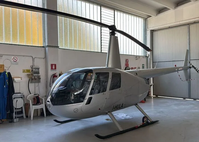 Exterior view of a 2004 Robinson R44 Raven II, I-PNTI.