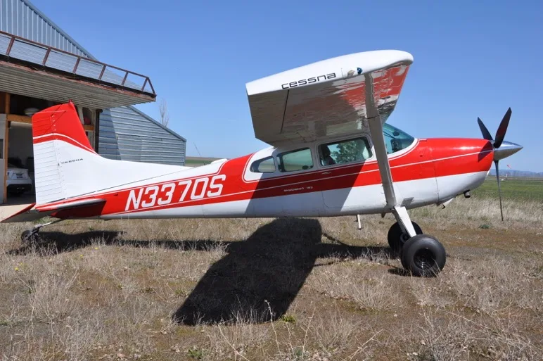 Exterior view of a 1973 Cessna 185F, N3370S.