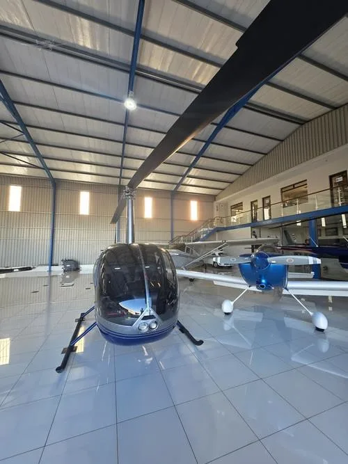 Exterior view of a 2007 ROBINSON R44 RAVEN II, N611TH.