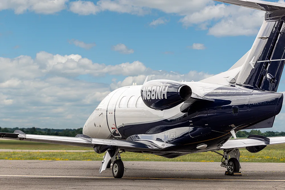 Exterior view of a 2014 Embraer Phenom 100E, N68NH.